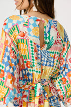 Otillie Playsuit in White Multi Conversational Print